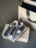 Golden Goose sneakers with glitter navy uppers, white star panels, beige sole, sherpa collar