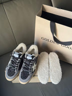 Golden Goose glitter navy sneakers with white star and beige soles, sherpa-lined collars