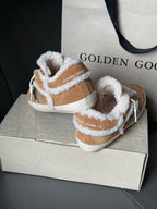 Pair of brown suede high-top sneakers with white shearling lining, blue star logo, white laces.