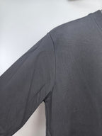 Dark charcoal sweatshirt shoulder and sleeve panel detail