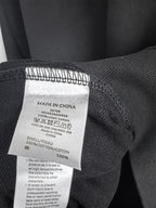 Dark charcoal sweatshirt care label with Made in China and cotton content