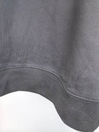 Dark charcoal sweatshirt ribbed hem with curved side opening