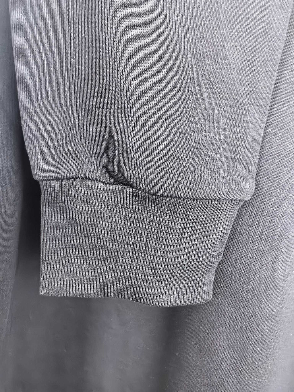 Dark charcoal sweatshirt ribbed sleeve cuff