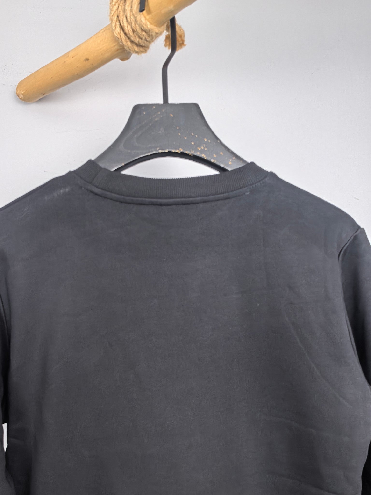Dark gray crewneck sweatshirt back neckline view