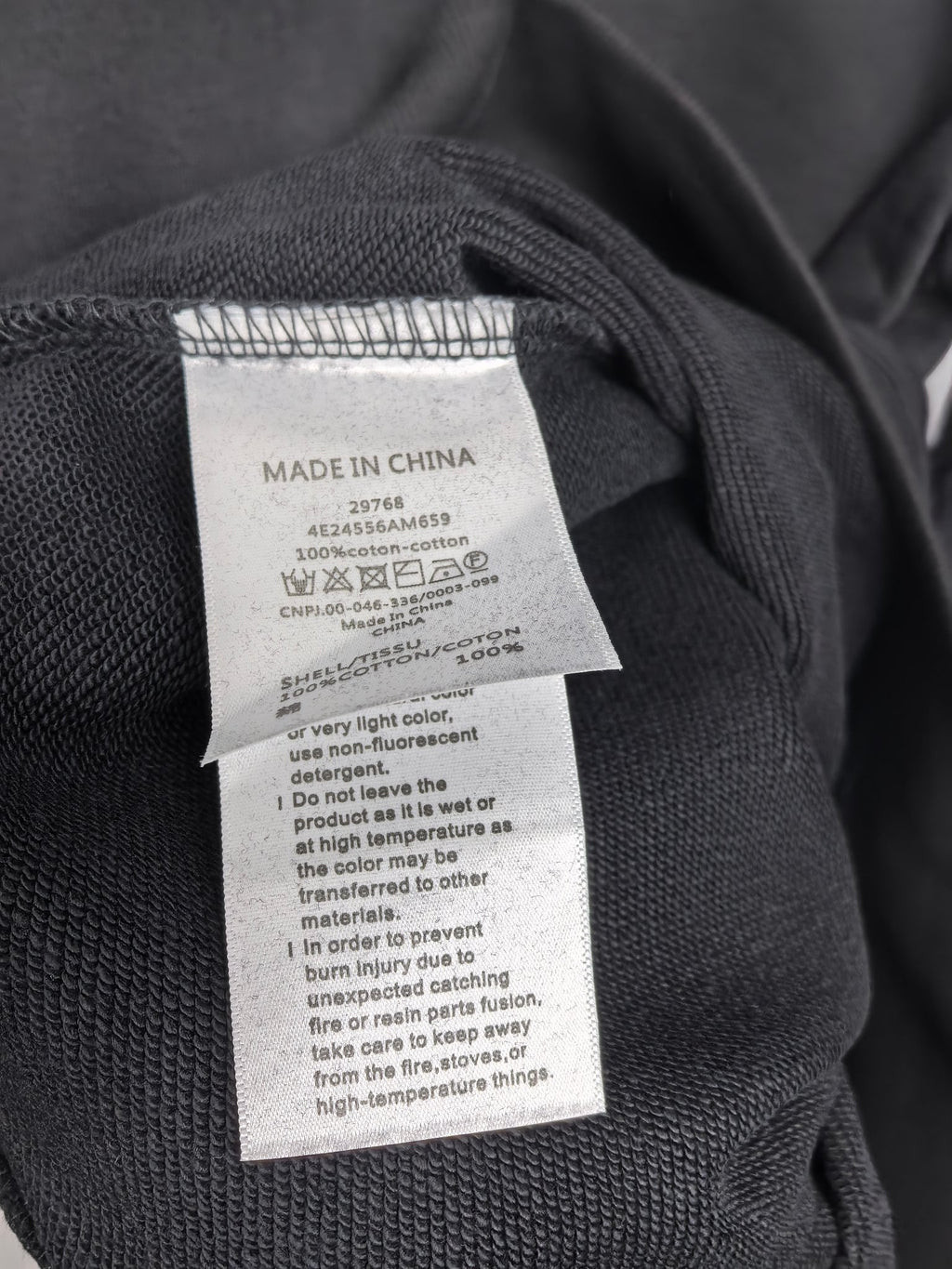 Dark gray crewneck sweatshirt with Made in China care label
