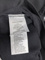Dark gray crewneck sweatshirt with Made in China care label