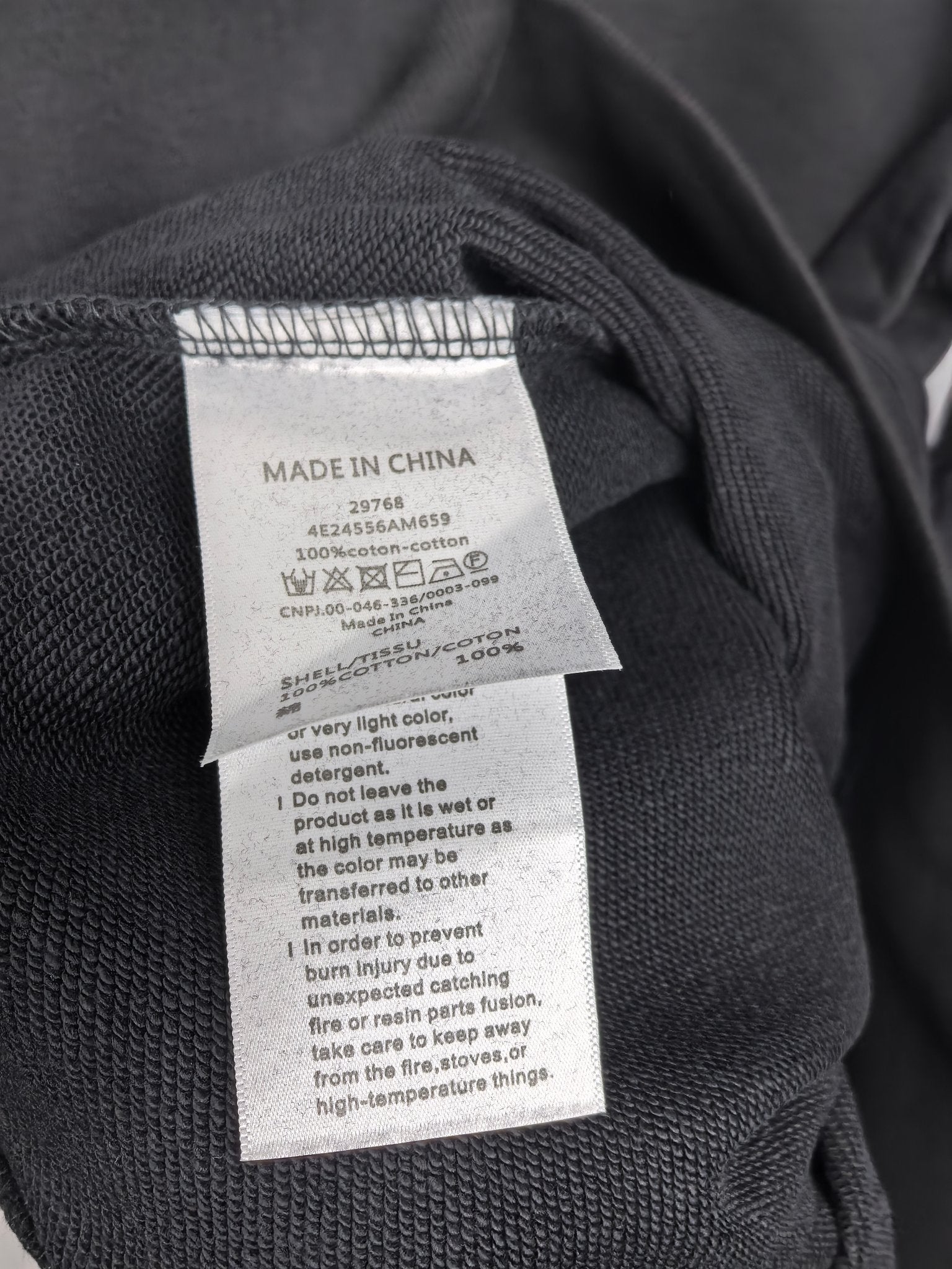 Dark gray crewneck sweatshirt with Made in China care label