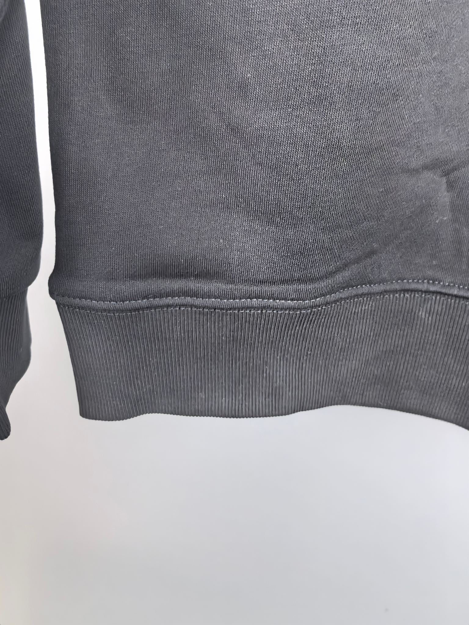 Dark gray crewneck sweatshirt ribbed hem detail