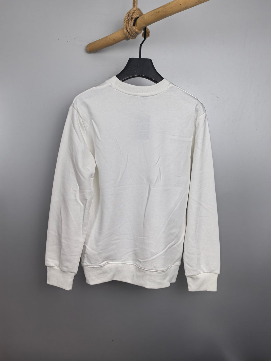 White Louis Vuitton long-sleeve sweatshirt on hanger, back view
