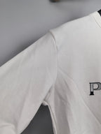 Long-sleeve sweatshirt, white, side view with partial PRADA logo