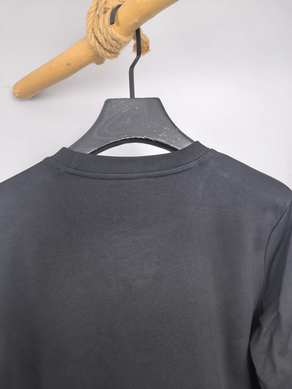 Dark gray sweatshirt back neck with crew collar seam