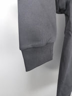 Dark gray sweatshirt hem with ribbed cuff detail