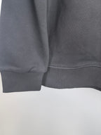 Dark gray sweatshirt hem ribbing detail