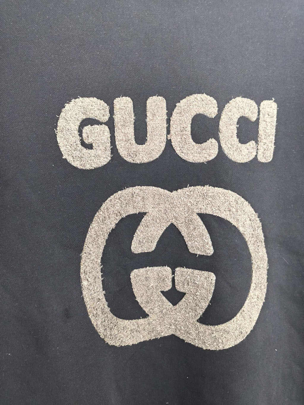 Gucci long-sleeve sweatshirt front with large GUCCI logo and G emblem print