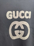 Gucci long-sleeve sweatshirt front with large GUCCI logo and G emblem print