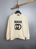 Cream long-sleeve sweatshirt with black GUCCI logo graphic on front