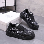 Versace luxury shoes, black logo lace-up sneakers with white script on sides