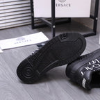 Versace luxury shoes, black outsole view with tread pattern and heel detail