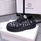 Versace luxury shoes, black logo lace-up sneakers on white shoebox