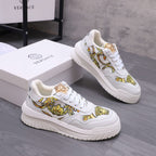 Versace luxury shoes, white lace-up sneakers with gold baroque stripe detail