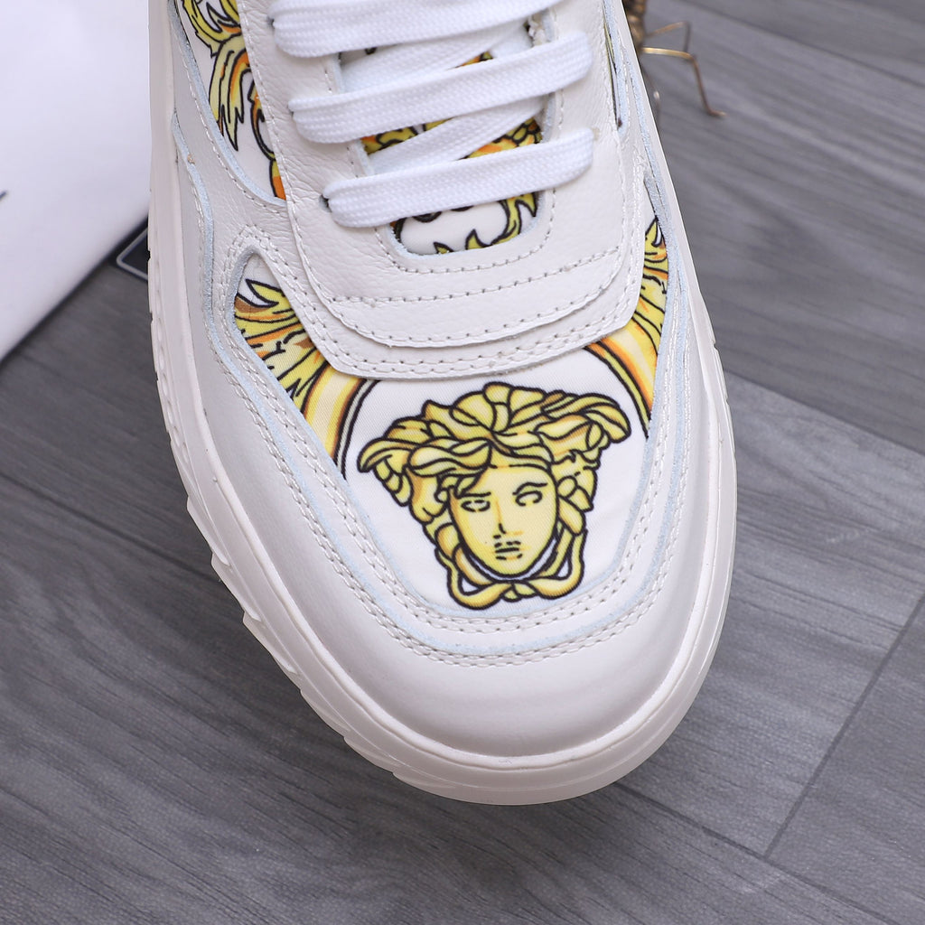 Versace luxury shoes, close-up white toe with gold Medusa portrait emblem