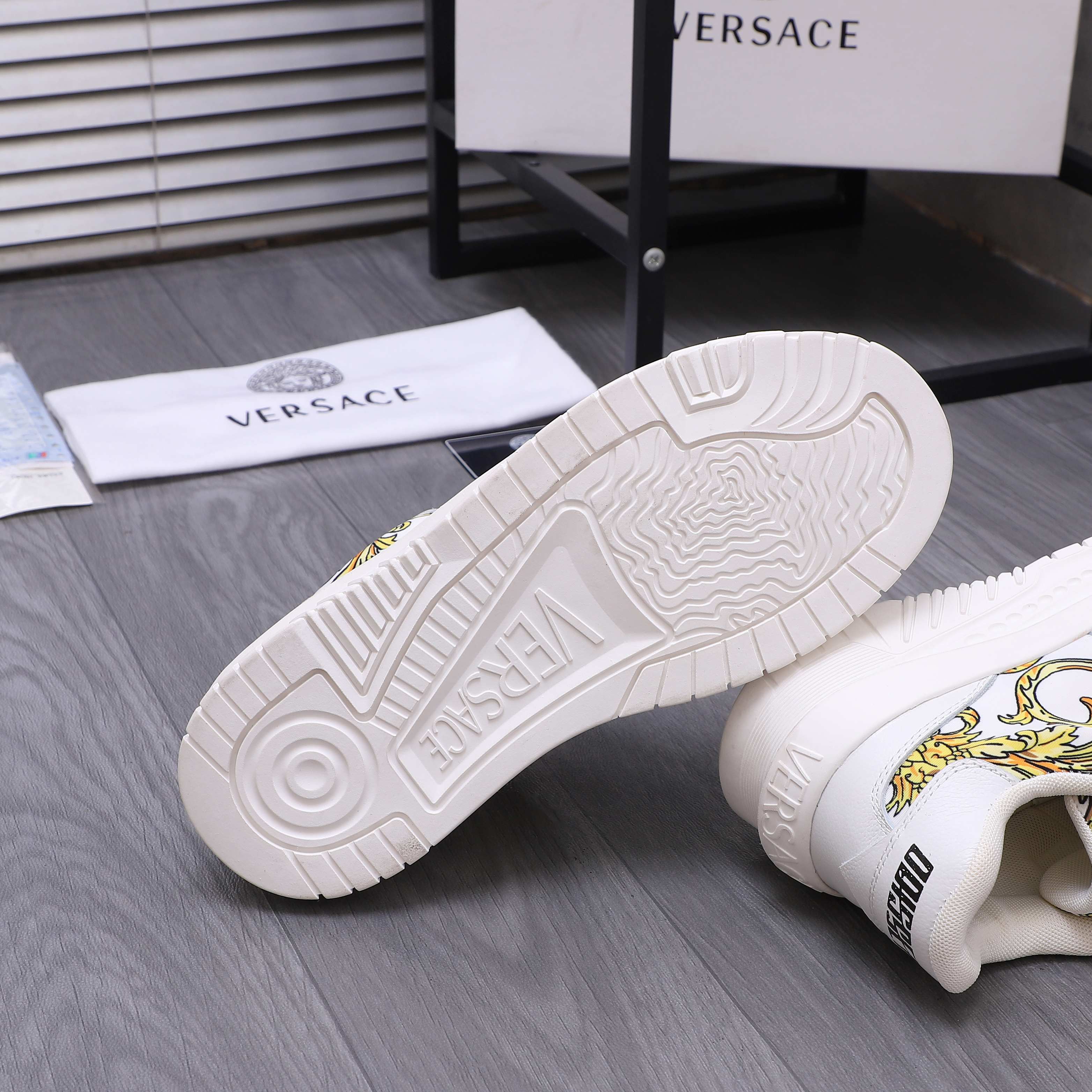 Versace luxury shoes, white outsole view with raised tread pattern