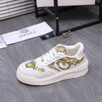 Versace luxury shoes, white sneakers with gold baroque motif and lace-up vamp