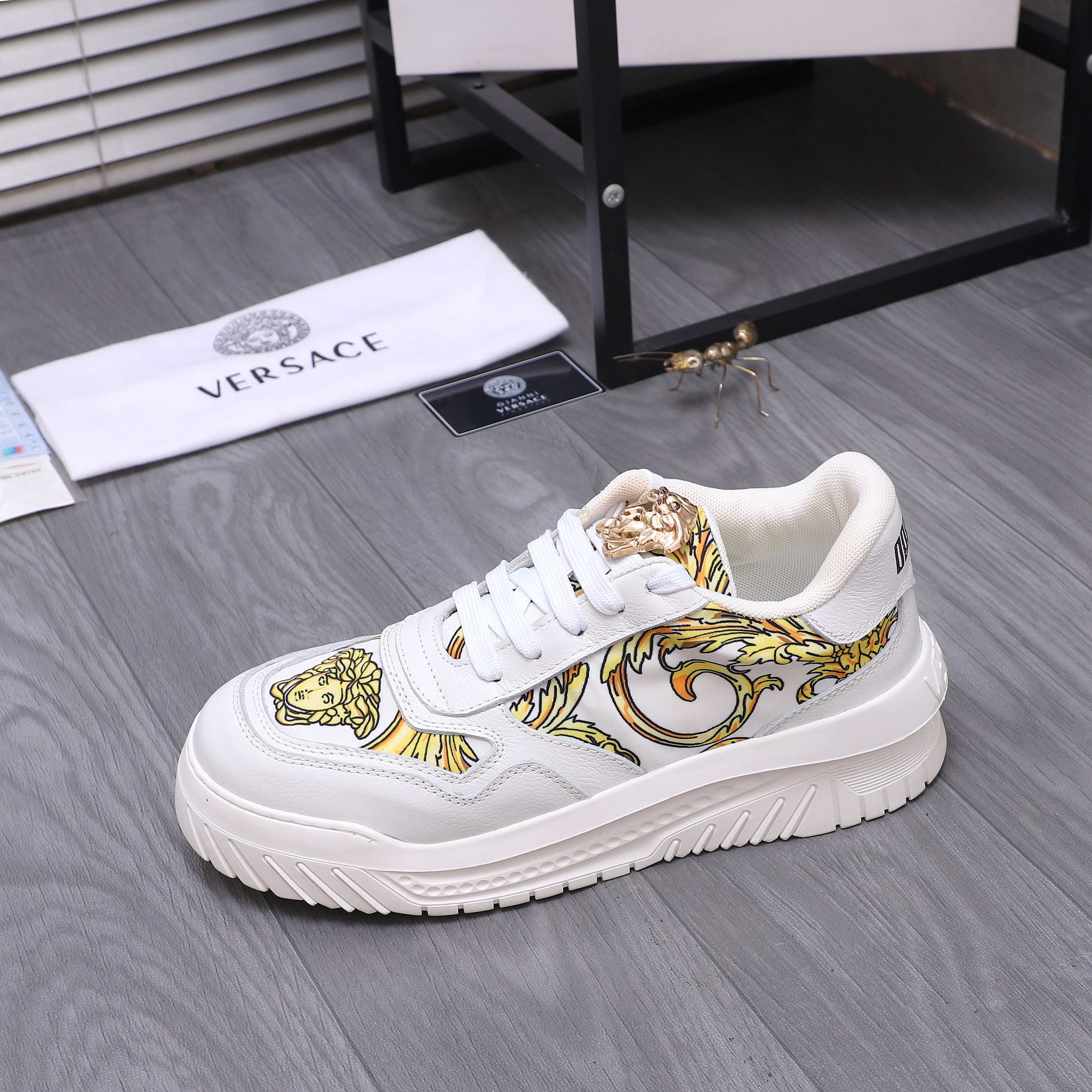 Versace luxury shoes, white sneakers with gold baroque motif and lace-up vamp