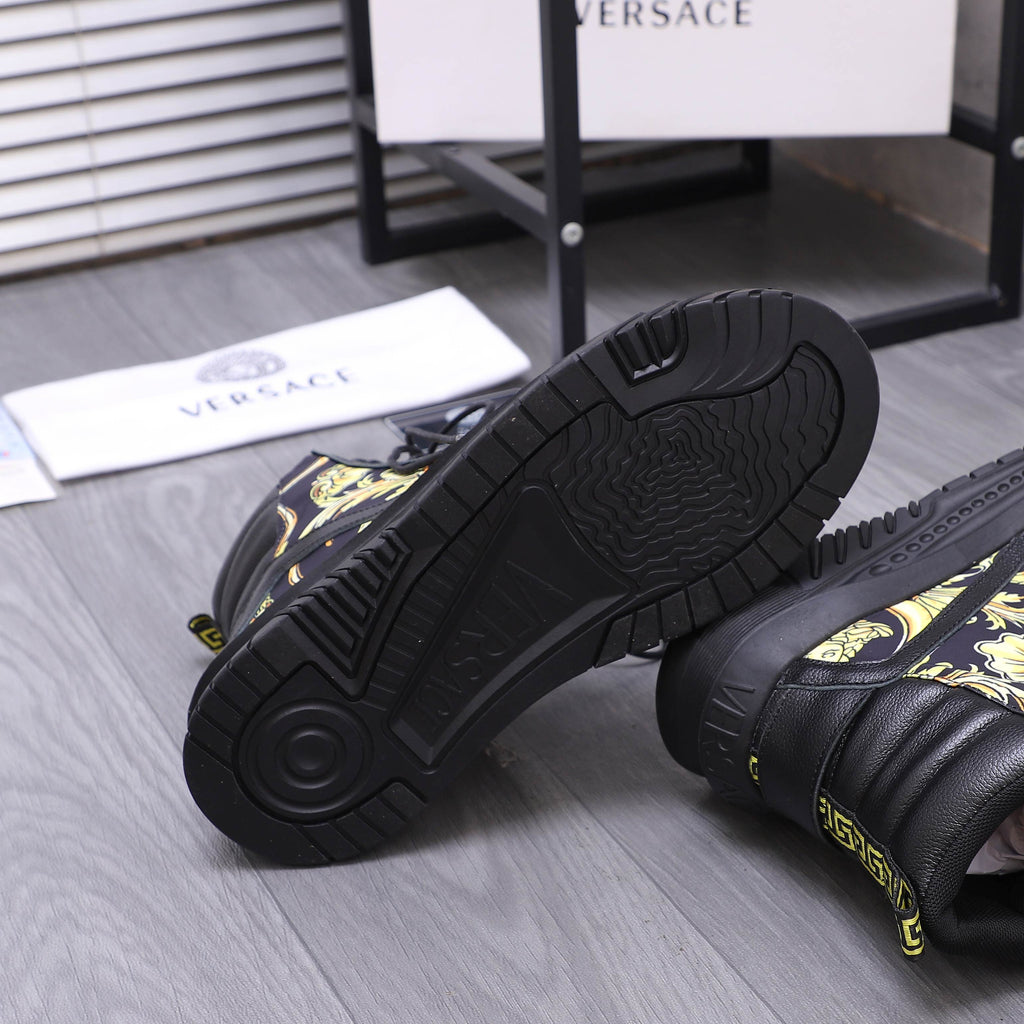 Side view of black high-top sneaker outsole with textured tread and patterned upper