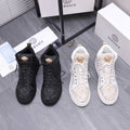 Versace high-top sneakers, black and white with lace-up and gold emblem detail