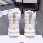 White high-top sneakers with gold accent strap and cushioned ankle collar