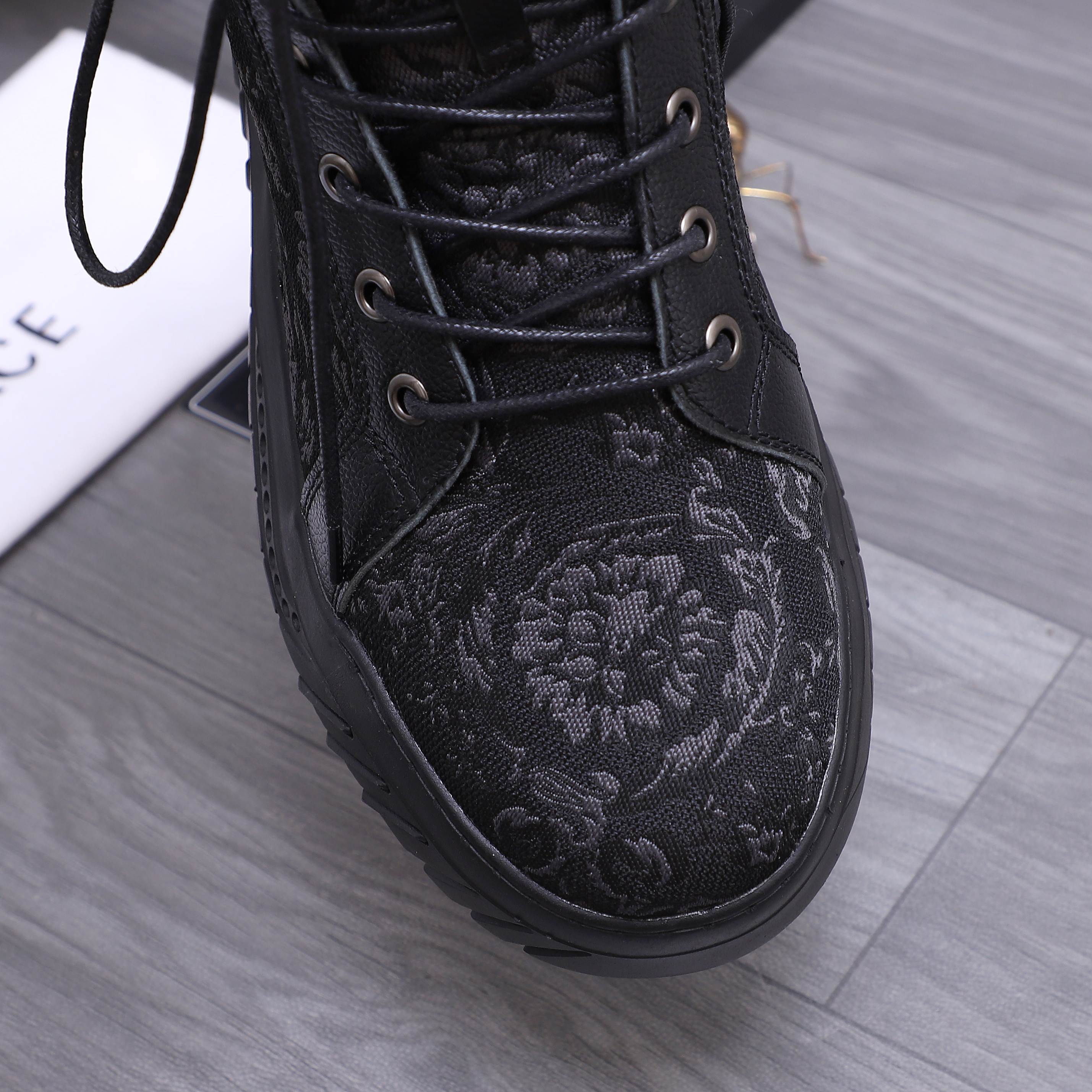 Versace black high-top sneaker with textured floral pattern and lace-up front