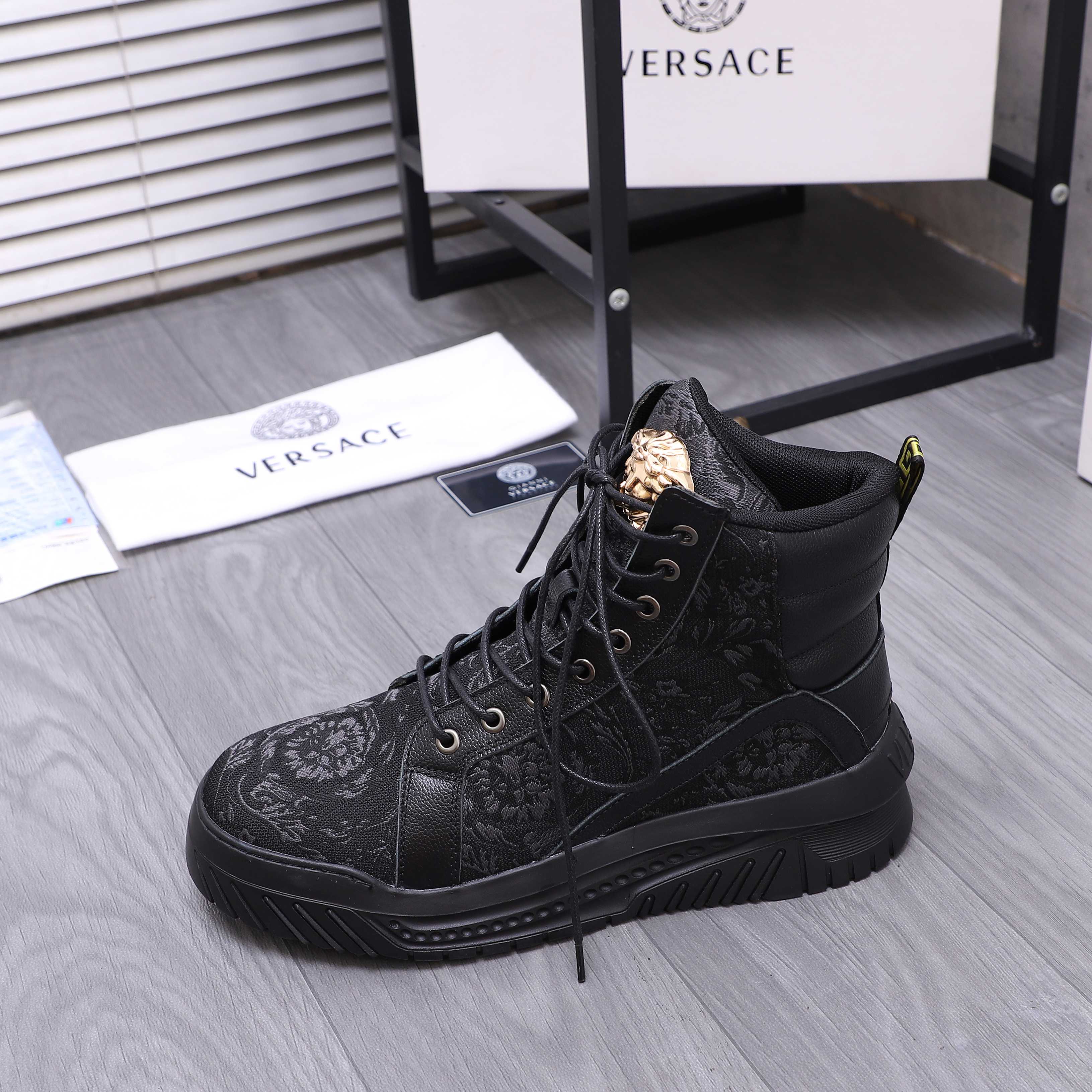 Versace black lace-up high-top sneakers with patterned uppers and gold crest detail