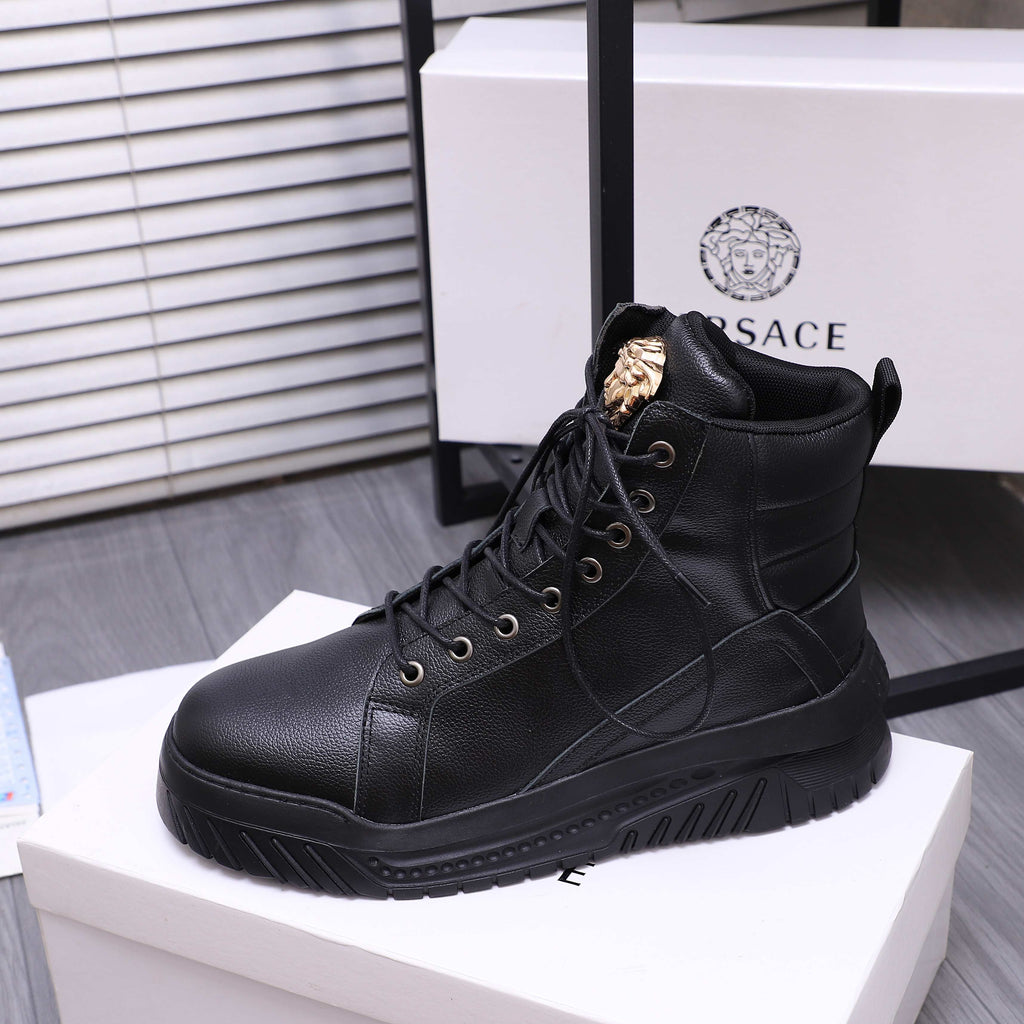 Black lace-up high-top sneaker boots with gold emblem on tongue and textured outsole