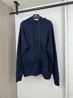 Dark blue long-sleeve hoodie with monogram print, kangaroo pocket, drawstring hood.