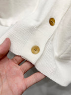 Dior white cardigan sleeve cuff with ribbed knit edge and gold button