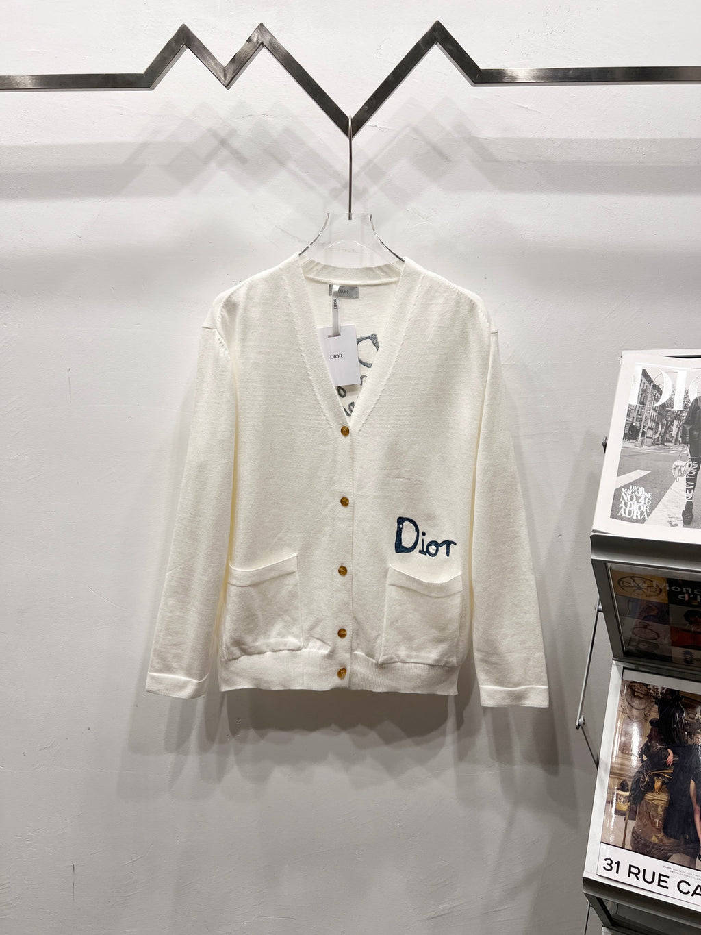 Dior white long-sleeve cardigan with V-neck and button front, chest pocket detail
