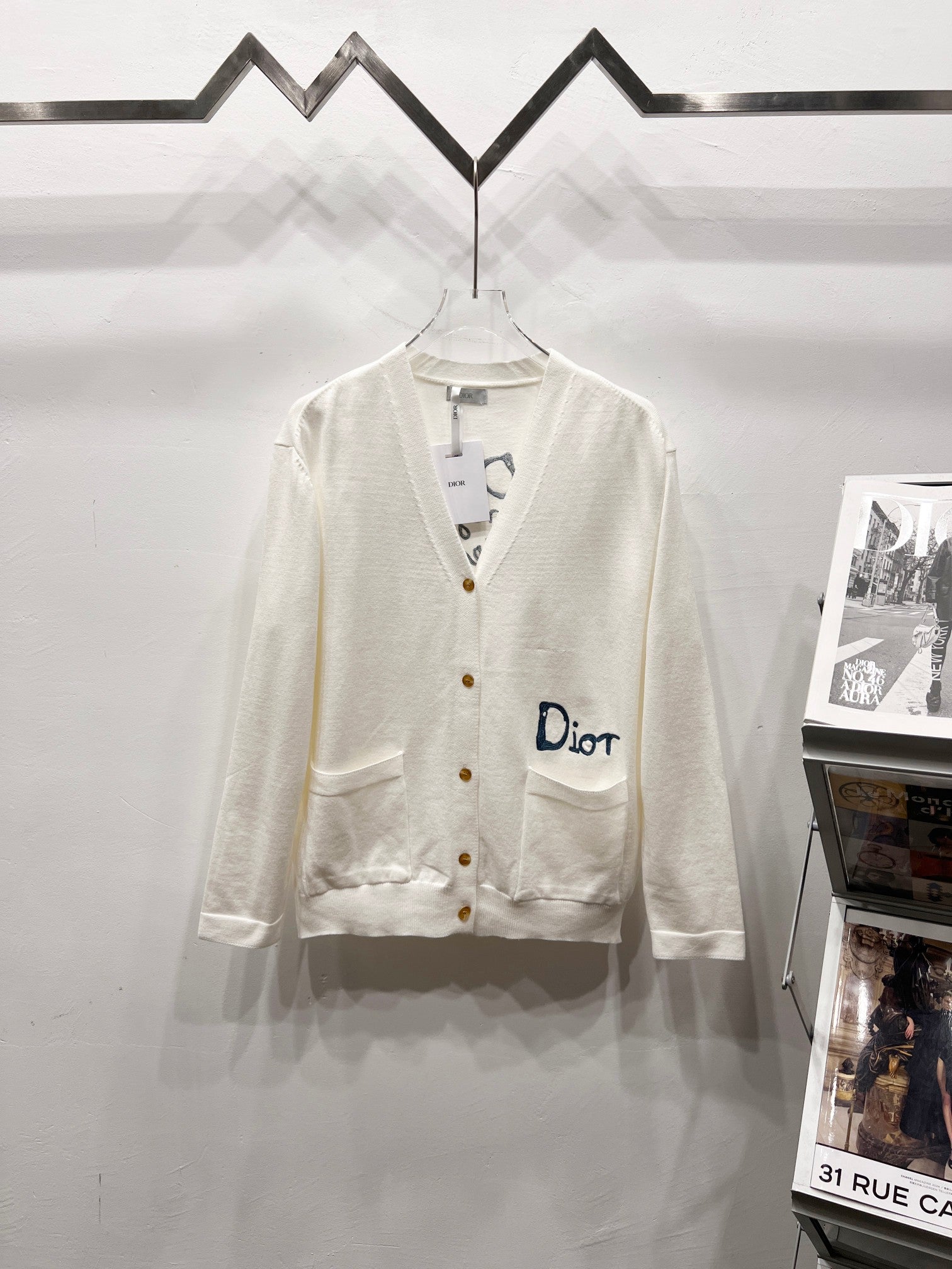 Dior white long-sleeve cardigan with V-neck and button front, chest pocket detail