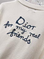 Dior white graphic text 'for my real friends' with blue script and heart icon