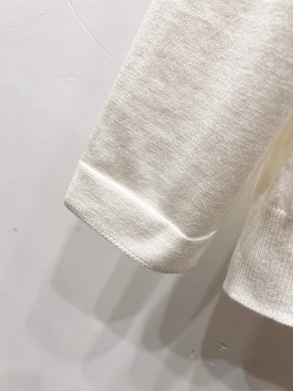 Dior white sleeve hem with ribbed cuff edge and stitched border