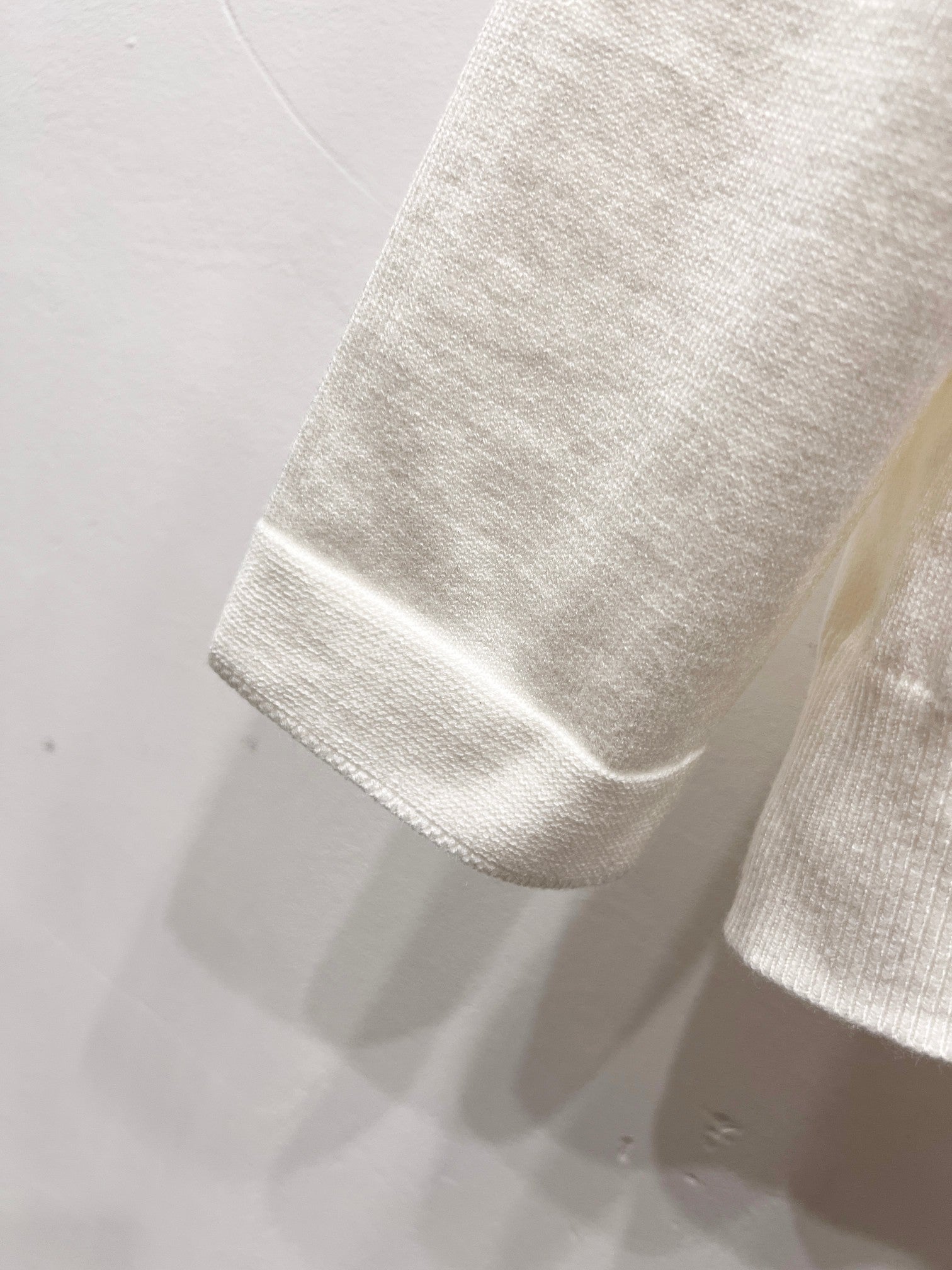 Dior white sleeve hem with ribbed cuff edge and stitched border