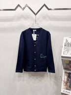 Navy V-neck cardigan with gold buttons and embroidered Dior logo on chest