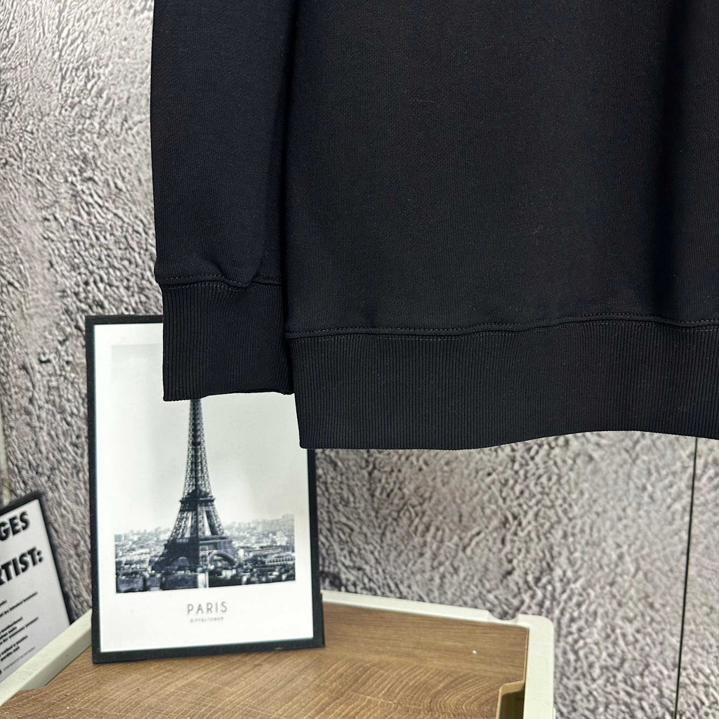 Black sweatshirt sleeve cuff and bottom hem detail