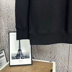 Black sweatshirt sleeve cuff and bottom hem detail