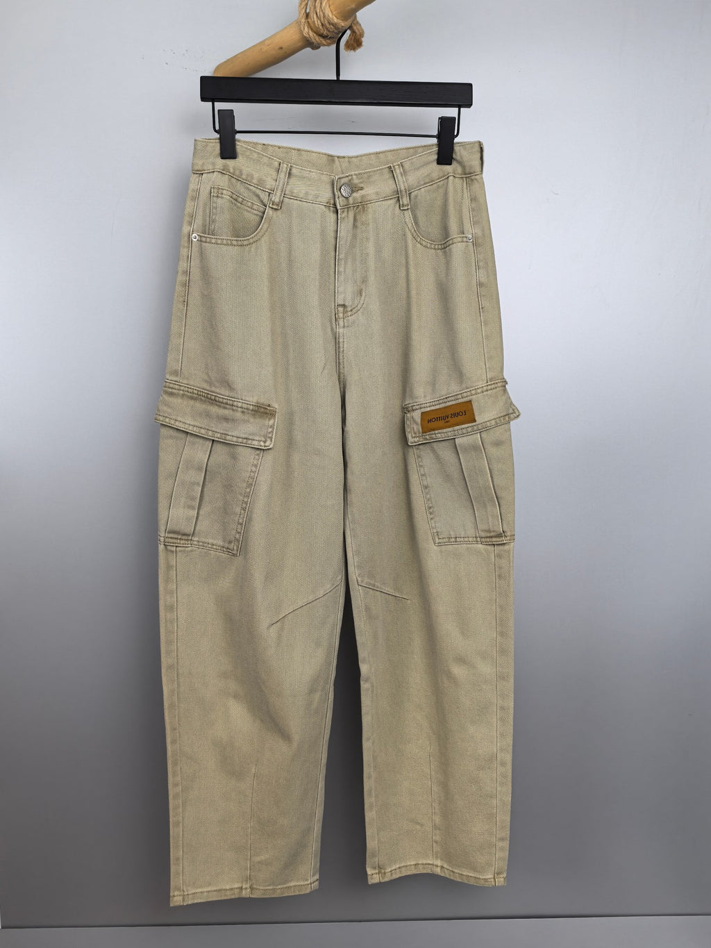 Beige denim cargo pants with belt loops and front button closure