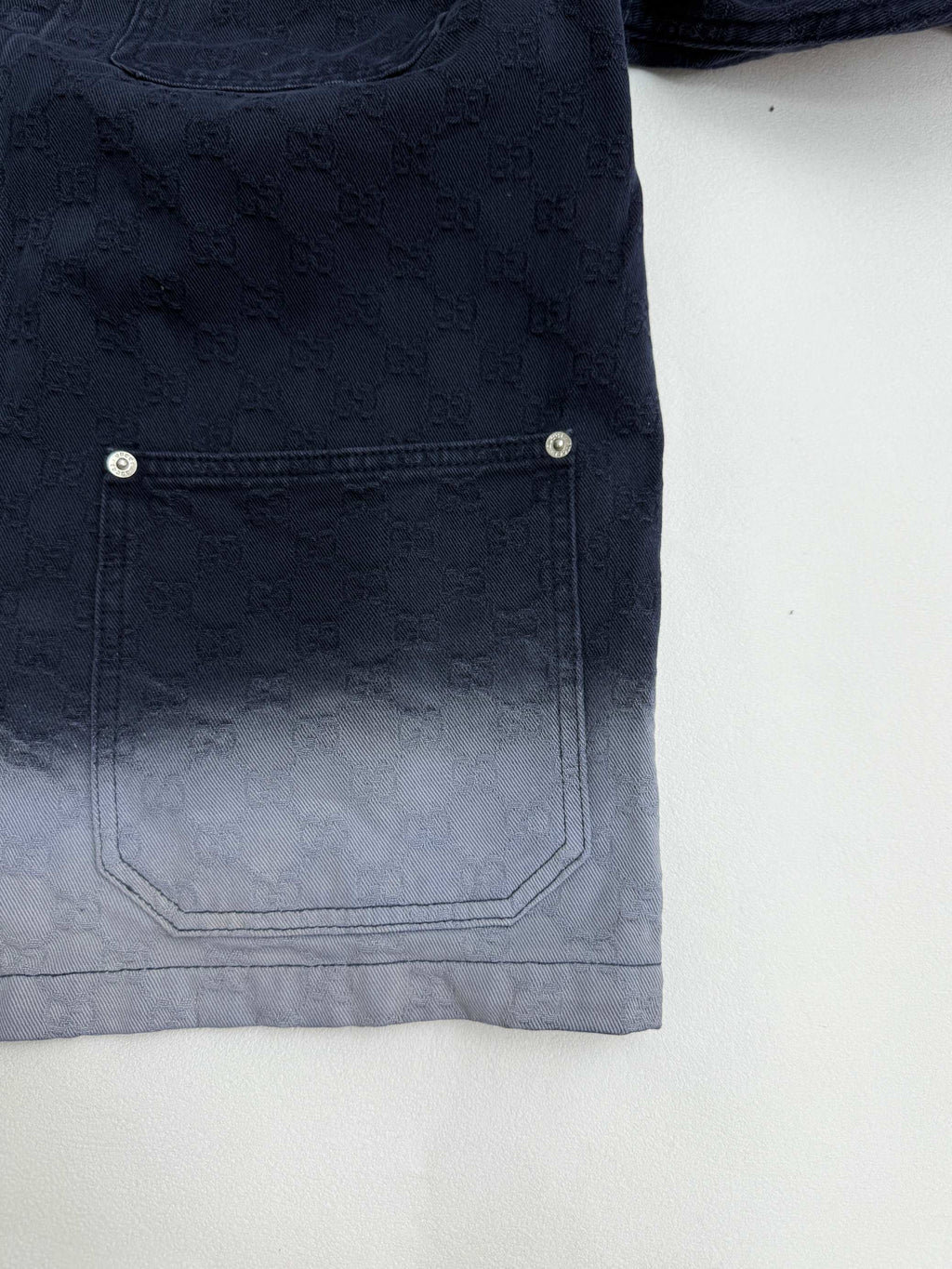 Gucci long denim jacket back hem panel with stitched patch pocket