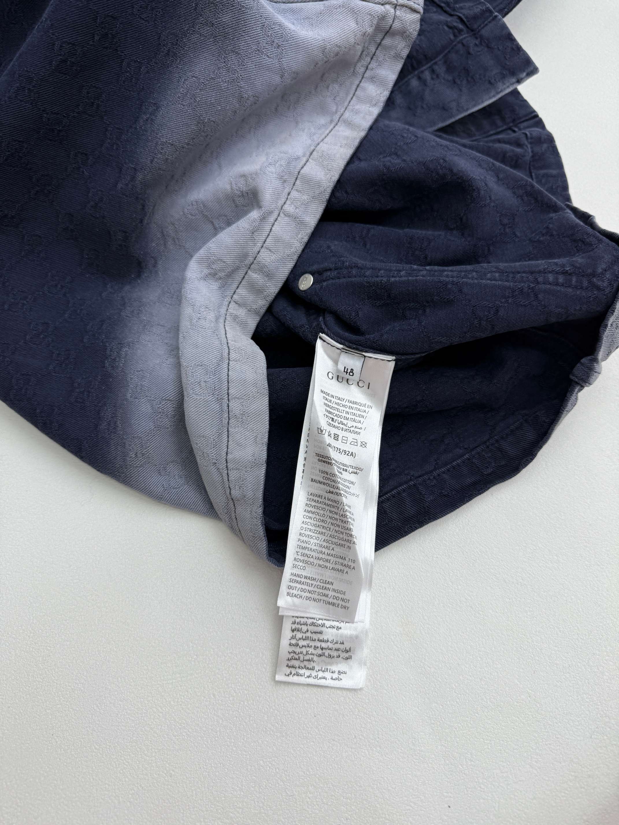 Gucci denim jacket with inside neck label tag and dark navy fabric