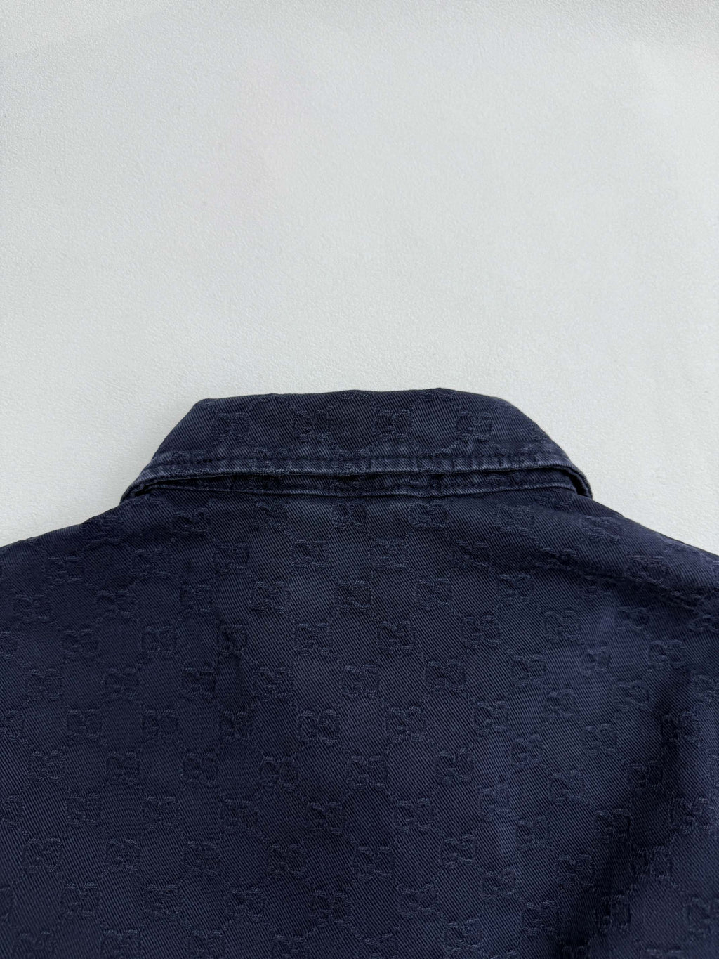 Gucci denim jacket back with high collar and textured dark navy finish