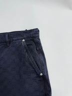 Navy Gucci pants back yoke close-up, metal button detail, GG pattern fabric