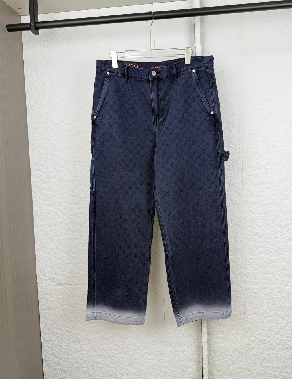 Navy Gucci pants, allover GG logo pattern, front button/zip, straight legs